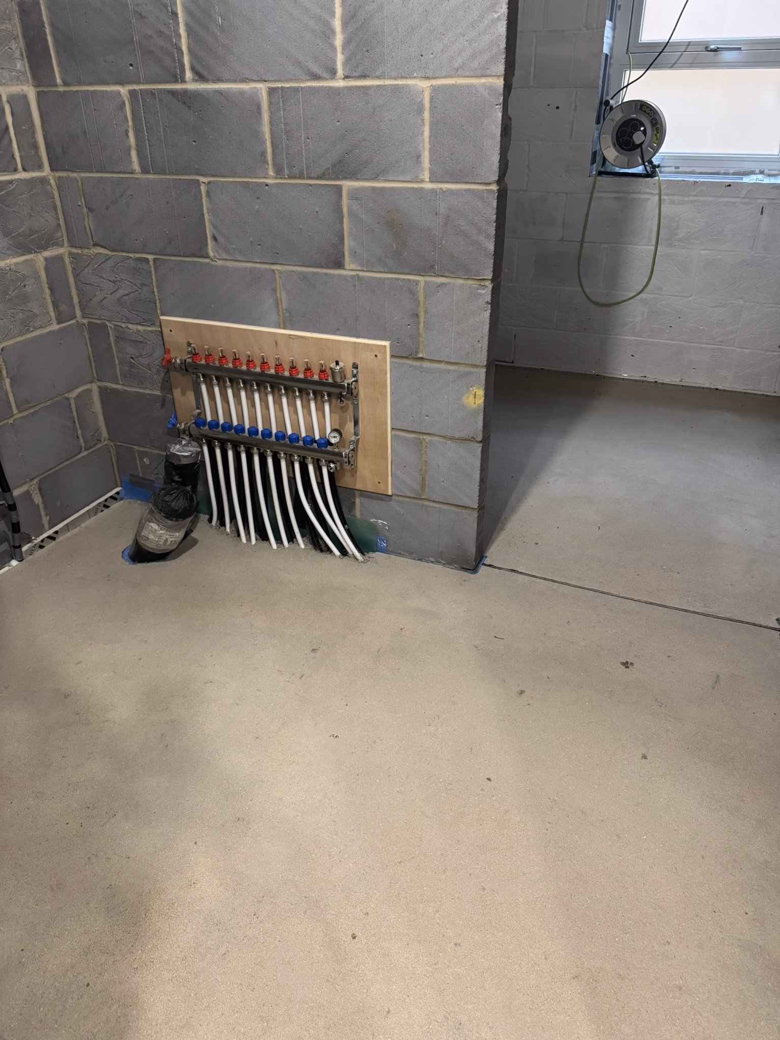 Eco-Home Self-Build underfloor heating manifold screeded